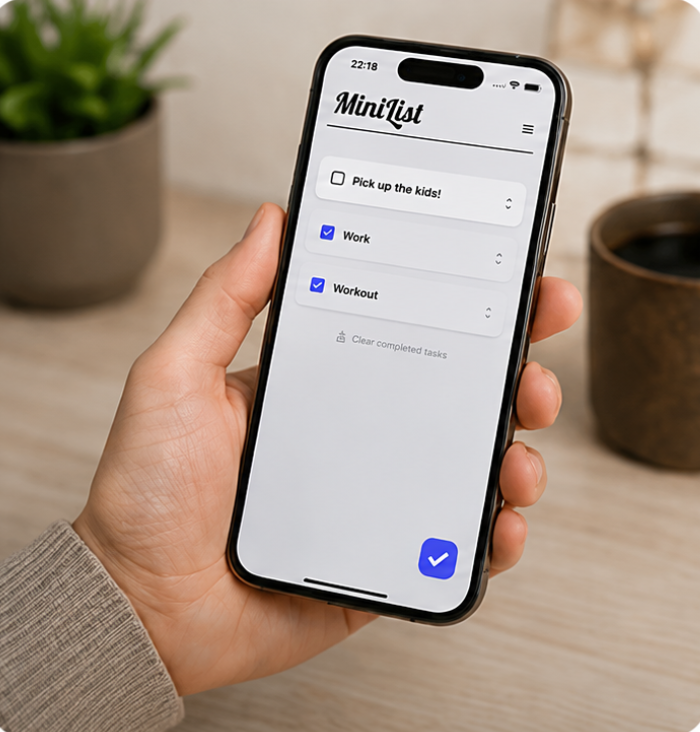 A person holding an iPhone with MiniList open